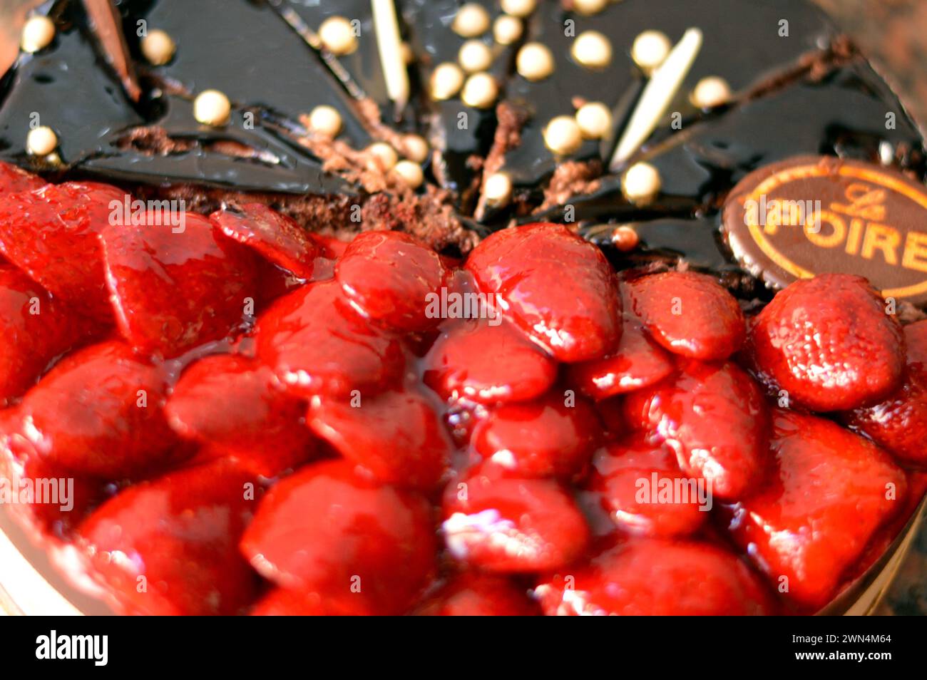 Cairo, Egypt, February 28 2024: La Poire Traditions of French patisseries and Egyptian baking roots, a half chocolate and half strawberry fruit and wh Stock Photo