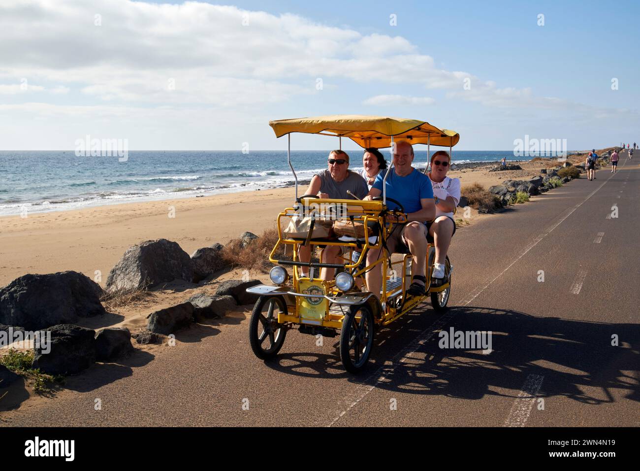 car style family bike rental on bike path near to airport Lanzarote, Canary Islands, spain Stock Photo