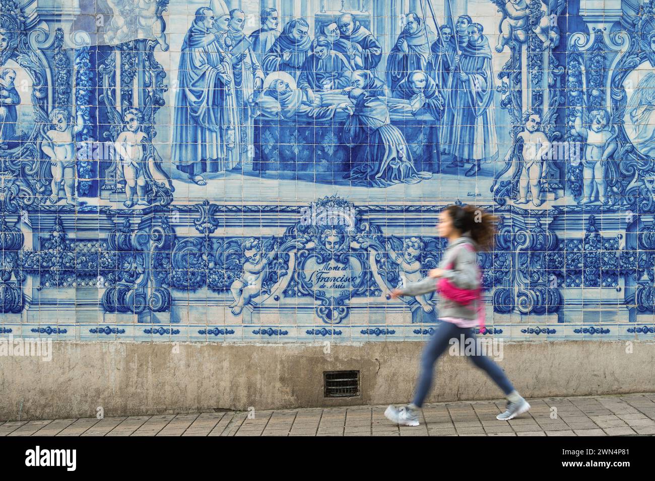 Traditional 18th-century Portuguese azulejo tilework on outer wall of the historic Capela das Almas church in Porto, Portugal. Stock Photo