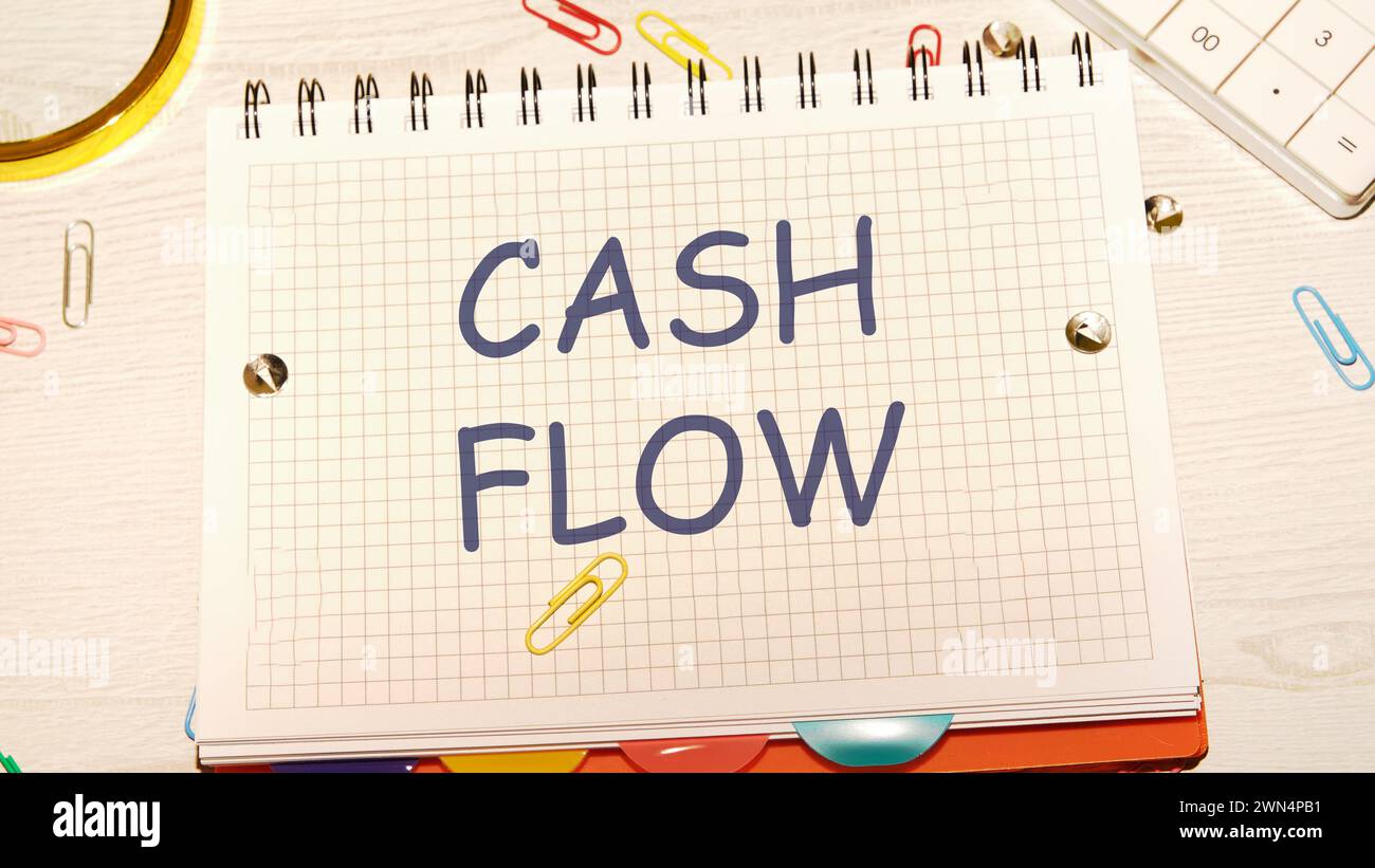 Cash flow text written on a notebook in a cage Stock Photo