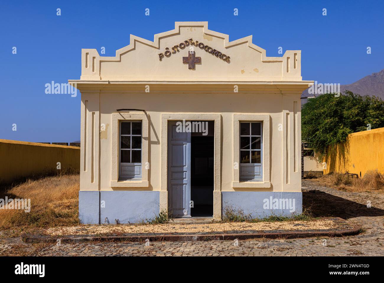 the blue and white infirmary or hospital building in the centre of the Tarrafel concentration camp on Santiago Cape Verde by Portuguese government Stock Photo