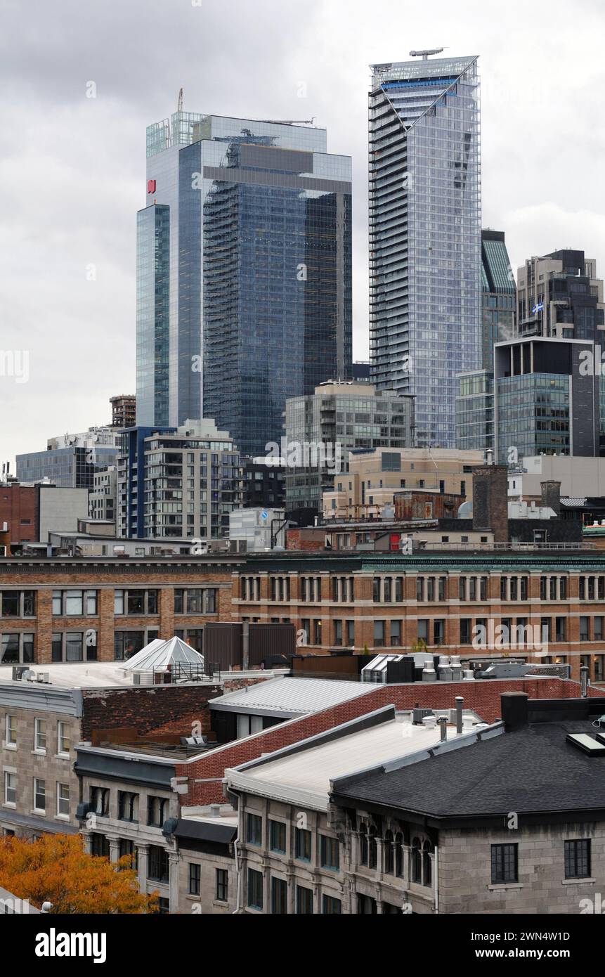 Modern office towers in downtown Montreal loom over historic buildings ...