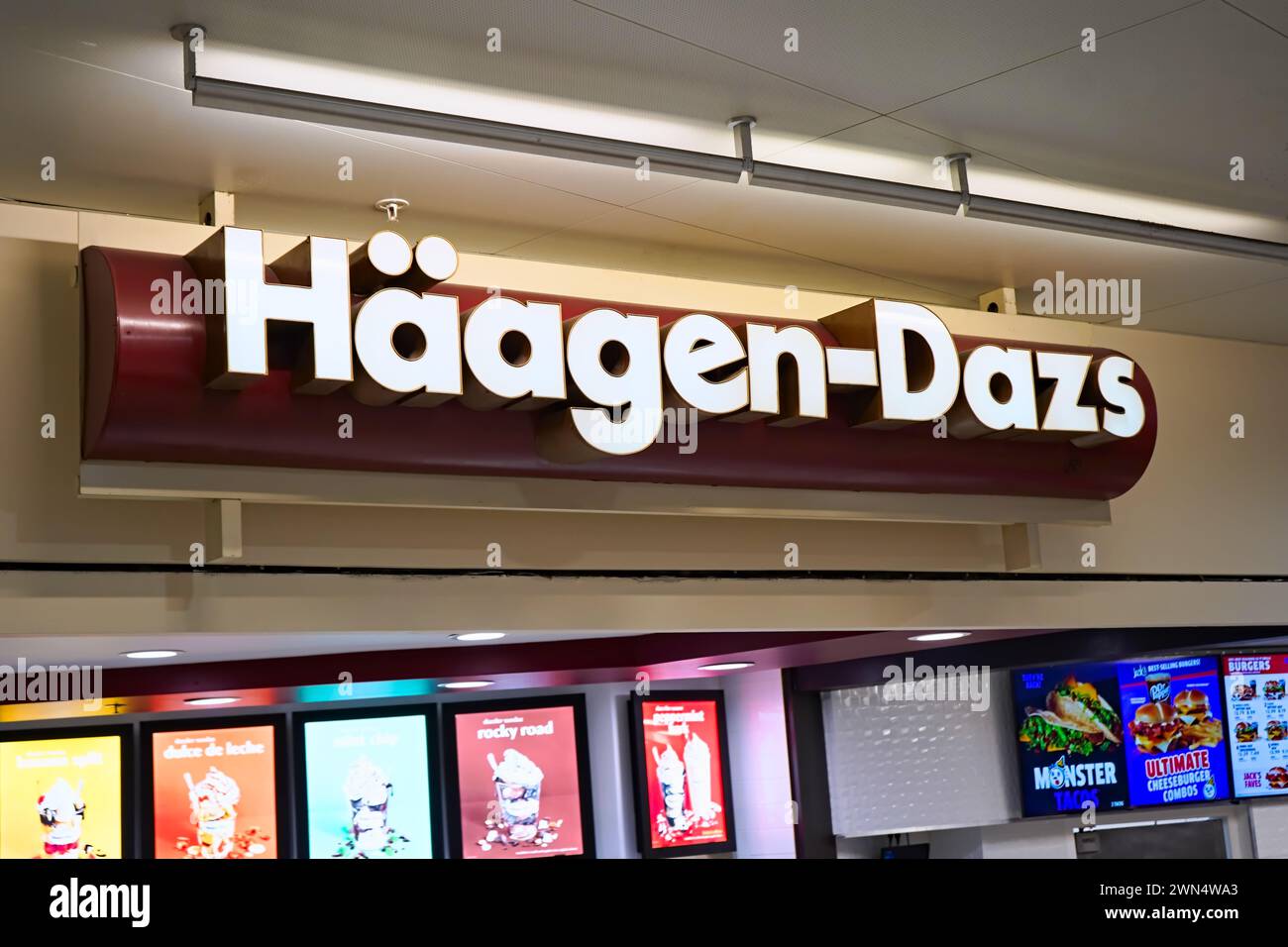 Honolulu, HI - Dec. 24, 2023: Haagen-Dazs ice cream manufacturer store signage at mall Ala Moana Mall food court. Stock Photo
