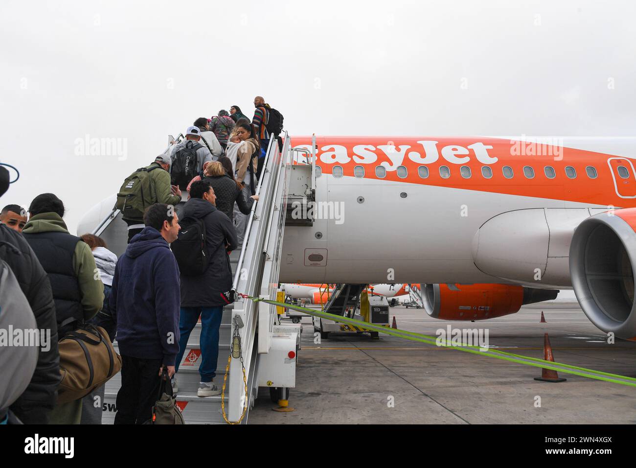 Morocco. 23rd Feb, 2024. People board an Easy Jet plane at Marrakech