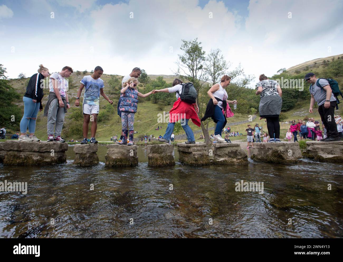 'Before' picture taken Sunday August 24,  showing day-tripper flocking to visit Dovedale and cross the stepping stones ahead of a washout forecast for Stock Photo