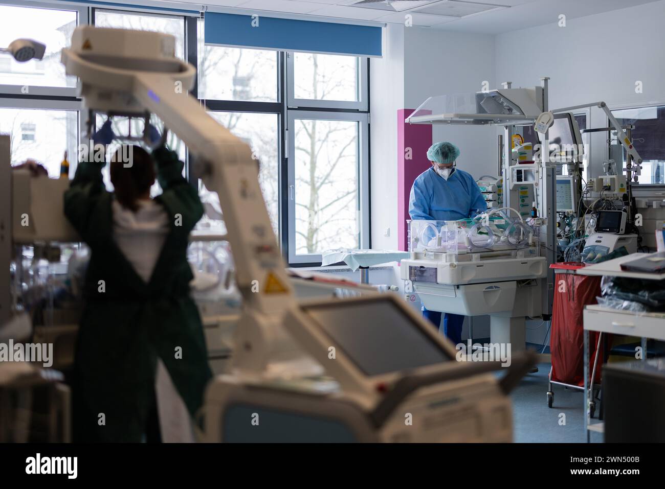 Essen, Germany. 29th Feb, 2024. Senior physician Mark Dzietko examines a newborn in the perinatal center, the neonatal intensive care unit, at the Department of Pediatrics at Essen University Hospital. According to experts, the situation at many children's hospitals is critical: a lack of doctors, a shortage of specialists, a lack of money and a reduction in beds are putting the facilities under increasing pressure. Credit: Rolf Vennenbernd/dpa/Alamy Live News Stock Photo