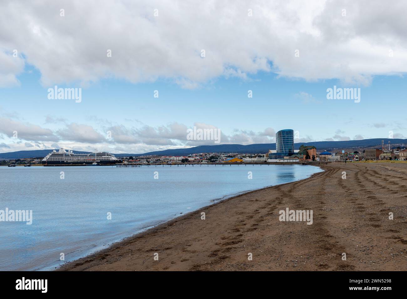 Punta Arenas, Magallanes y la Antartica Chilena Region January 20, 2024: Ships in the port area of Punta Arenas in the Strait of Magallanes. And skyli Stock Photo