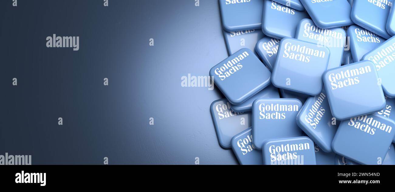 Logos of the American investment bank and financial services company Goldman Sachs on a heap on a table. Copy space. Web banner format. Stock Photo