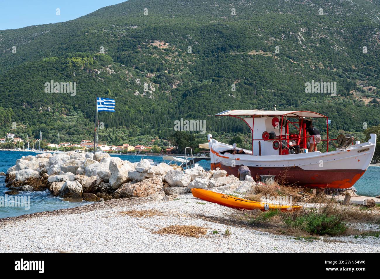 Traditional fishing boats by Sami Bay in the pretty fishing village of Karavomilos, Kefalonia, Greece. Stock Photo