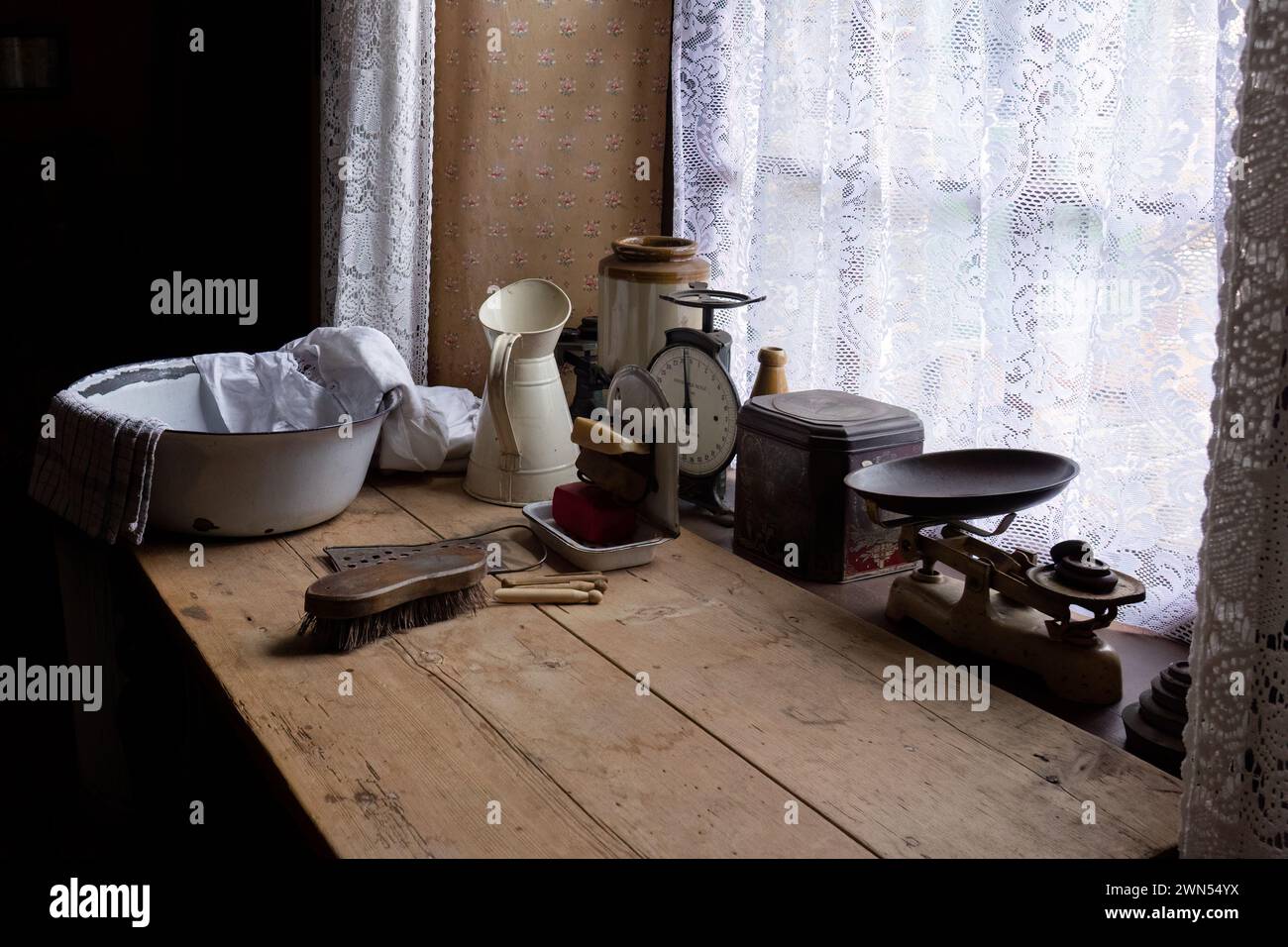 Old fashioned kitchen items in a window Stock Photo