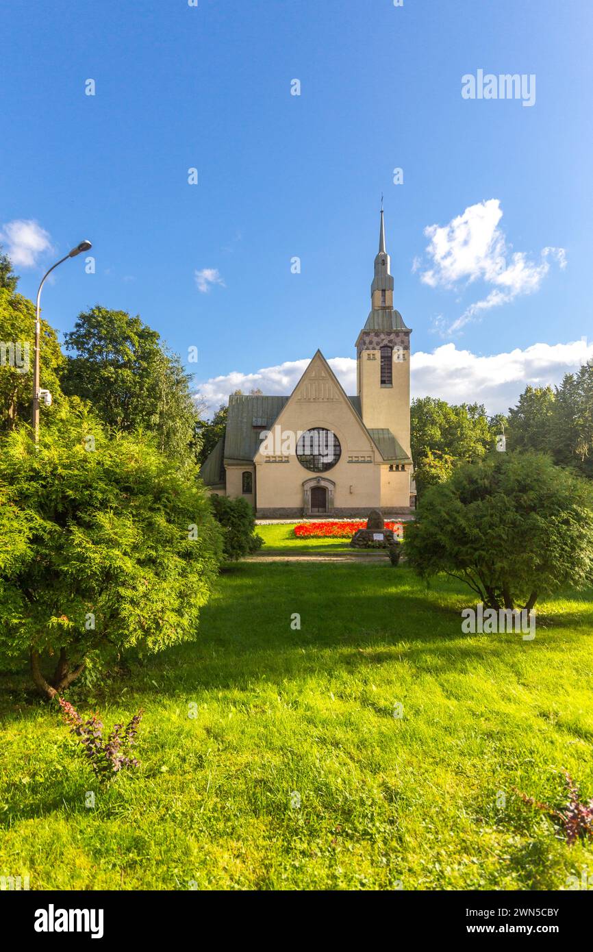 Famous Evangelical Lutheran Church of Transfiguration of Lord in Zelenogorsk. Green alley with grass and Square of Victory. Old Finnish city Terijoki Stock Photo