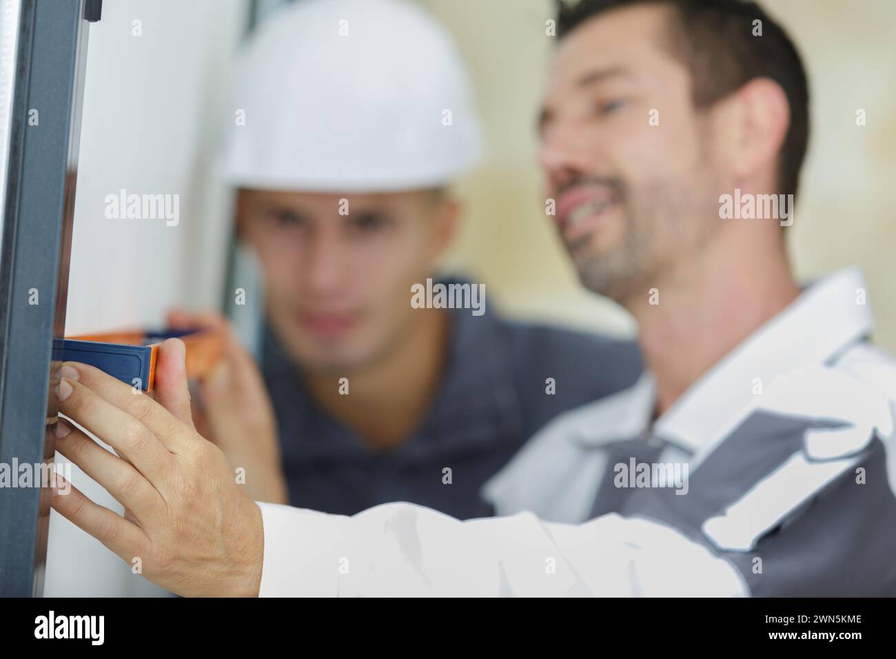 male hands making window measurements Stock Photo
