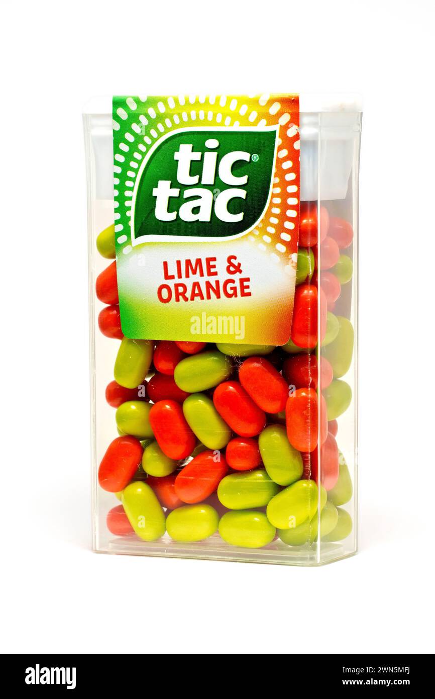 Close up of an unopened pack of orange and lime Tic Tac or Tic Tacs, isolated against a white background Stock Photo