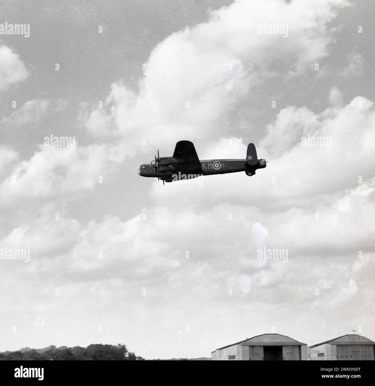 1960s, historical, WW2 Lancaster bomber, KM-B, in flight, England, UK. Stock Photo