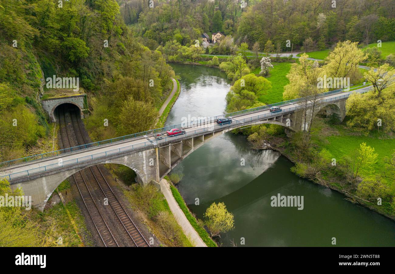 Bridge going over the train tracks and the river in weinbach, hessen, germany Stock Photo