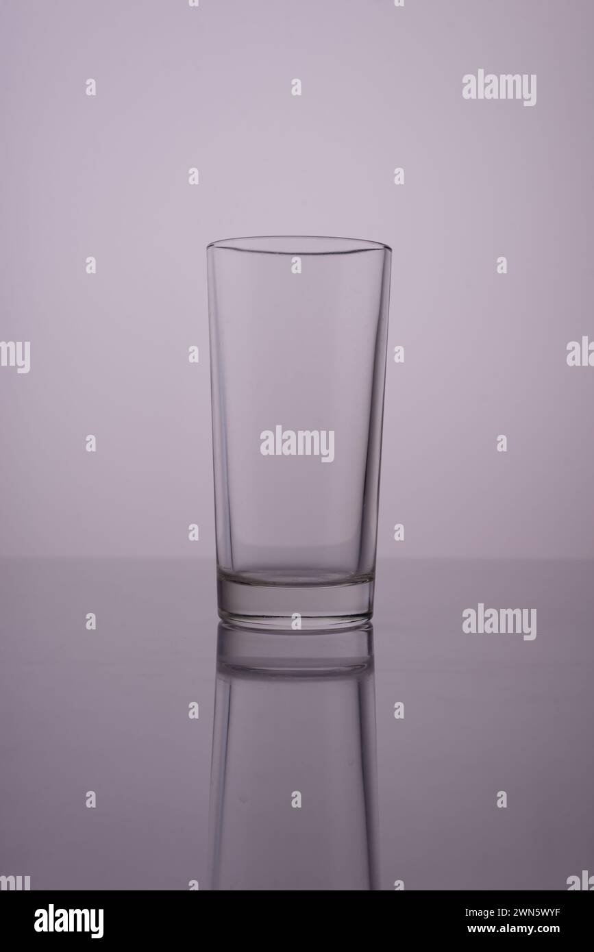 glass of clean water on a gray white background. Stock Photo