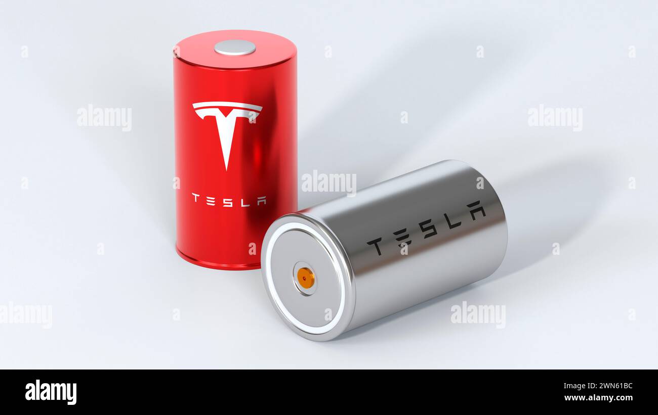 two Lithium-ion 4680 Tesla batteries with logo, one High-capacity accumulator, tables cell, Energy Storage, electric vehicle production, High Tech Aut Stock Photo