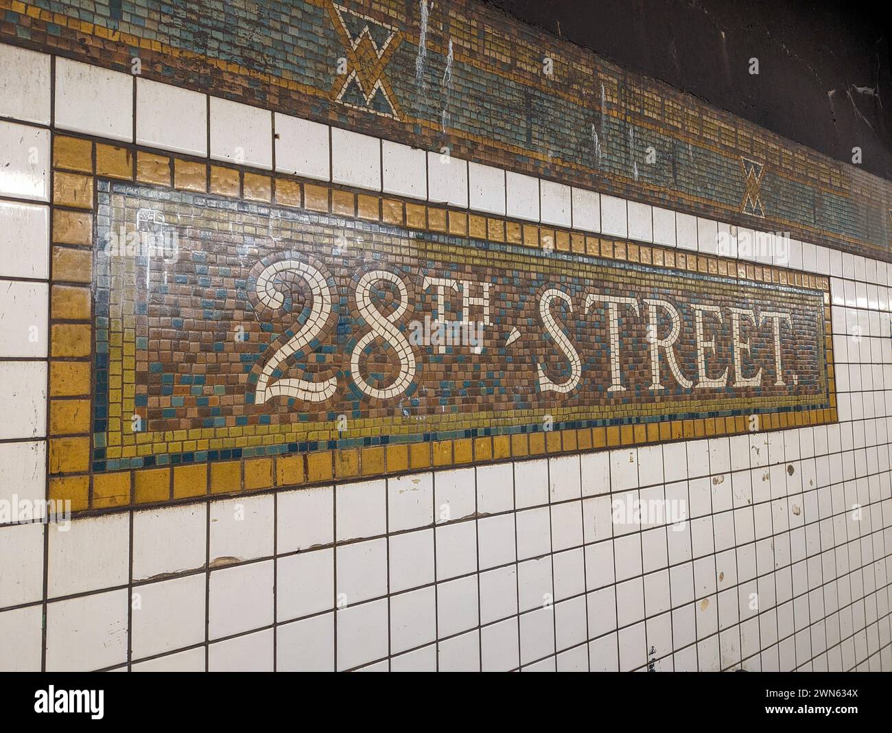 Mosaic subway sign for 28th Street Station in New York Stock Photo - Alamy