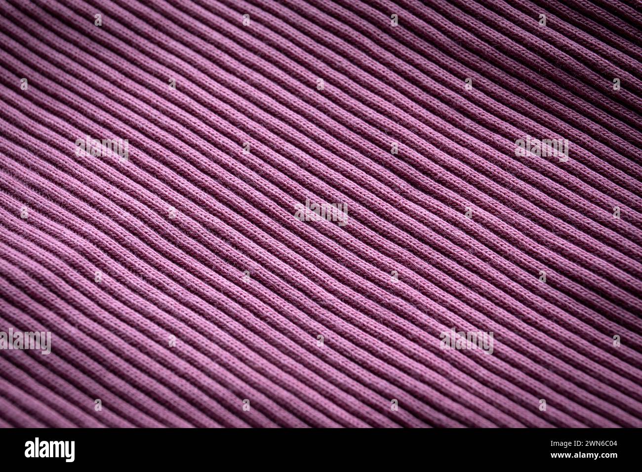 Purple knit close-up, ribbed, distinct texture. Abstract background. Stock Photo