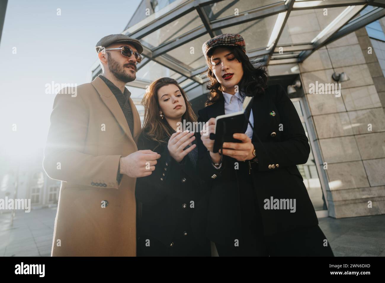 Three young professionals collaborate hi-res stock photography and ...