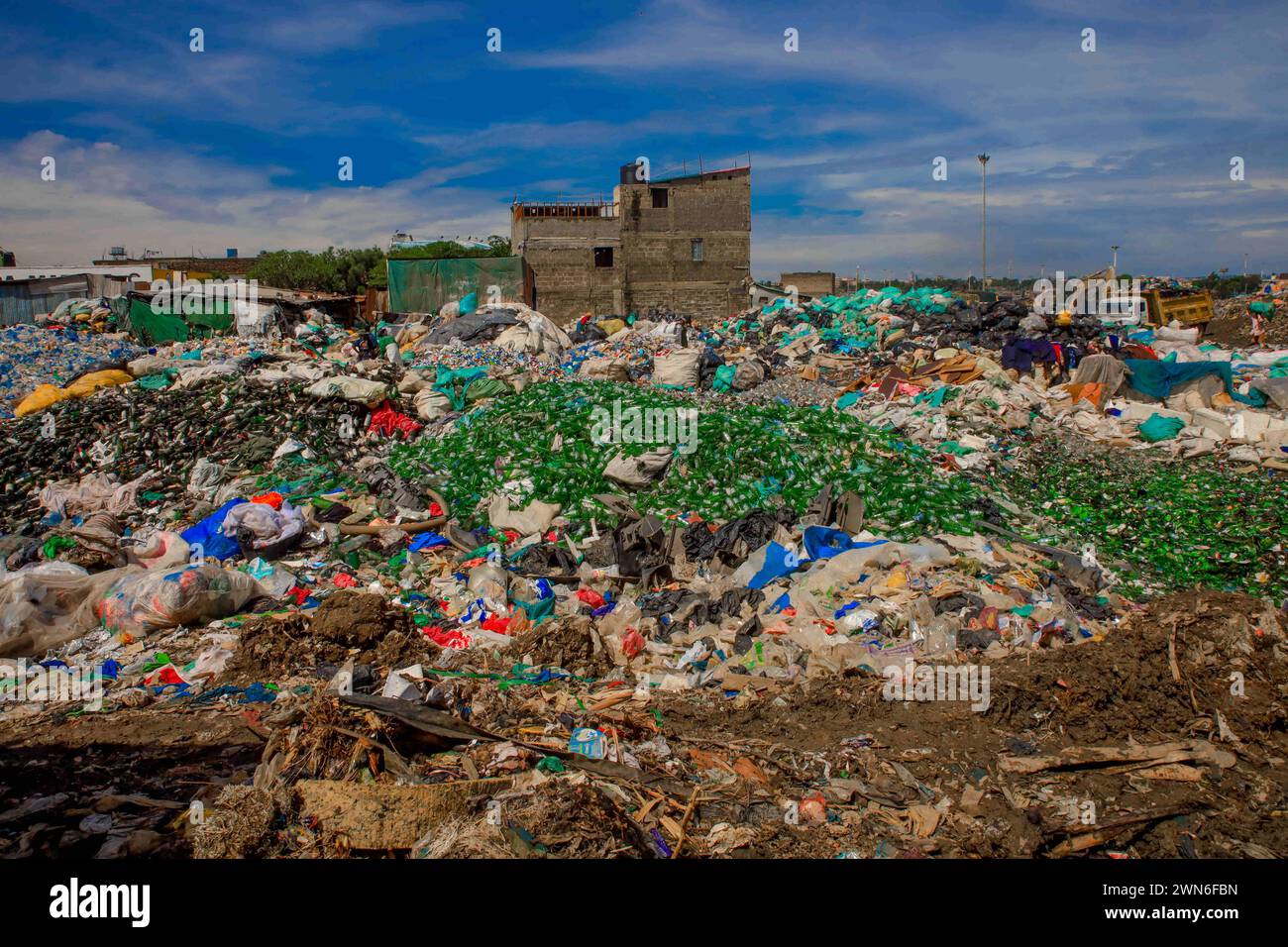 Nairobi, KENYA. 28th Feb, 2024. A collection of glass bottles at the Dandora dumpsite to be sold