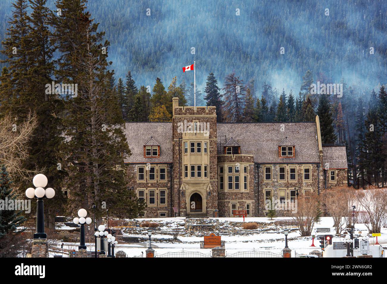BANFF, ALBERTA, CANADA - FEB. 22, 2024: The Historic Banff National Park Administration Building in the Cascades of Time Garden on Banff Avenue in the Stock Photo