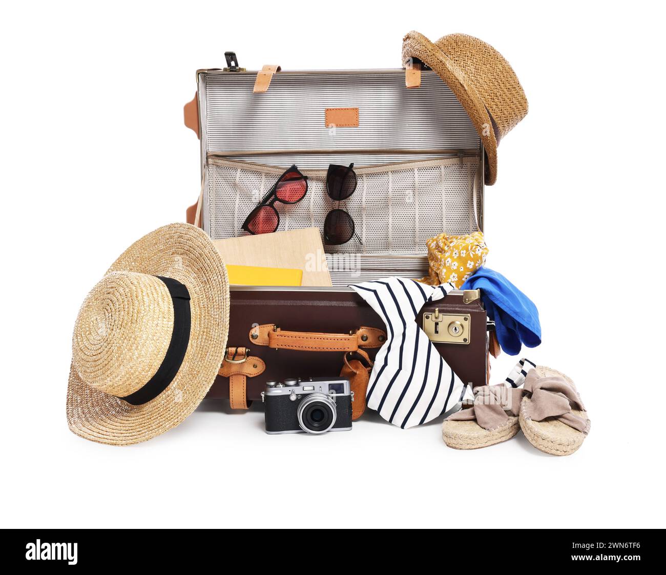 Clothes, camera and suitcase on white background. Prepare for travel Stock Photo
