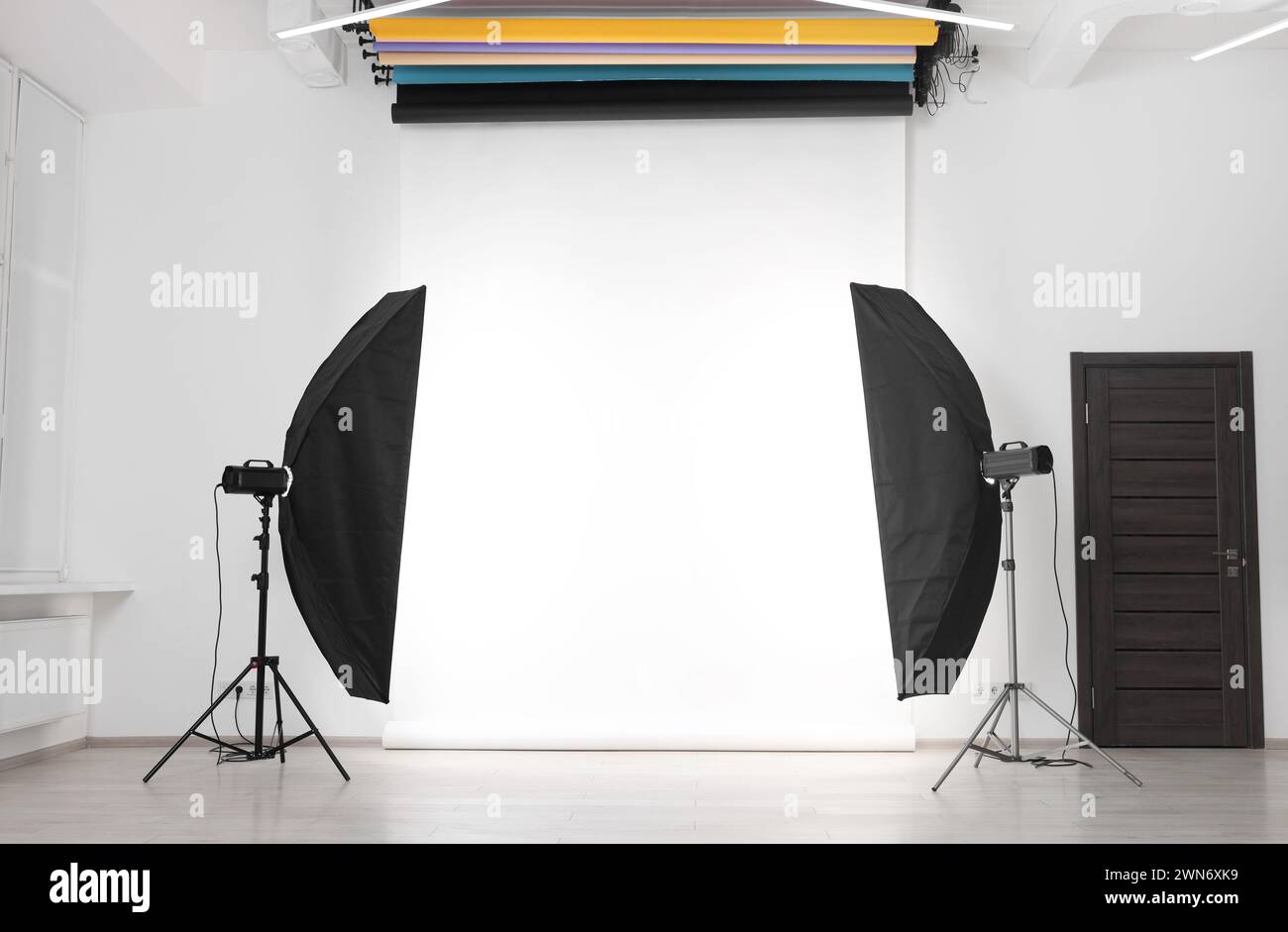 White photo background and professional lighting equipment in studio Stock Photo