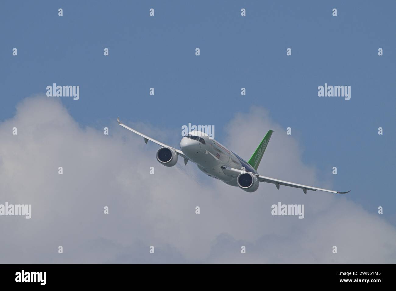 SINGAPORE - FEBRUARY 20, 2024:  China commercial narrow-body aircraft, the COMAC C919 B-001F doing an aerial display at the Singapore Airshow 2024. Stock Photo