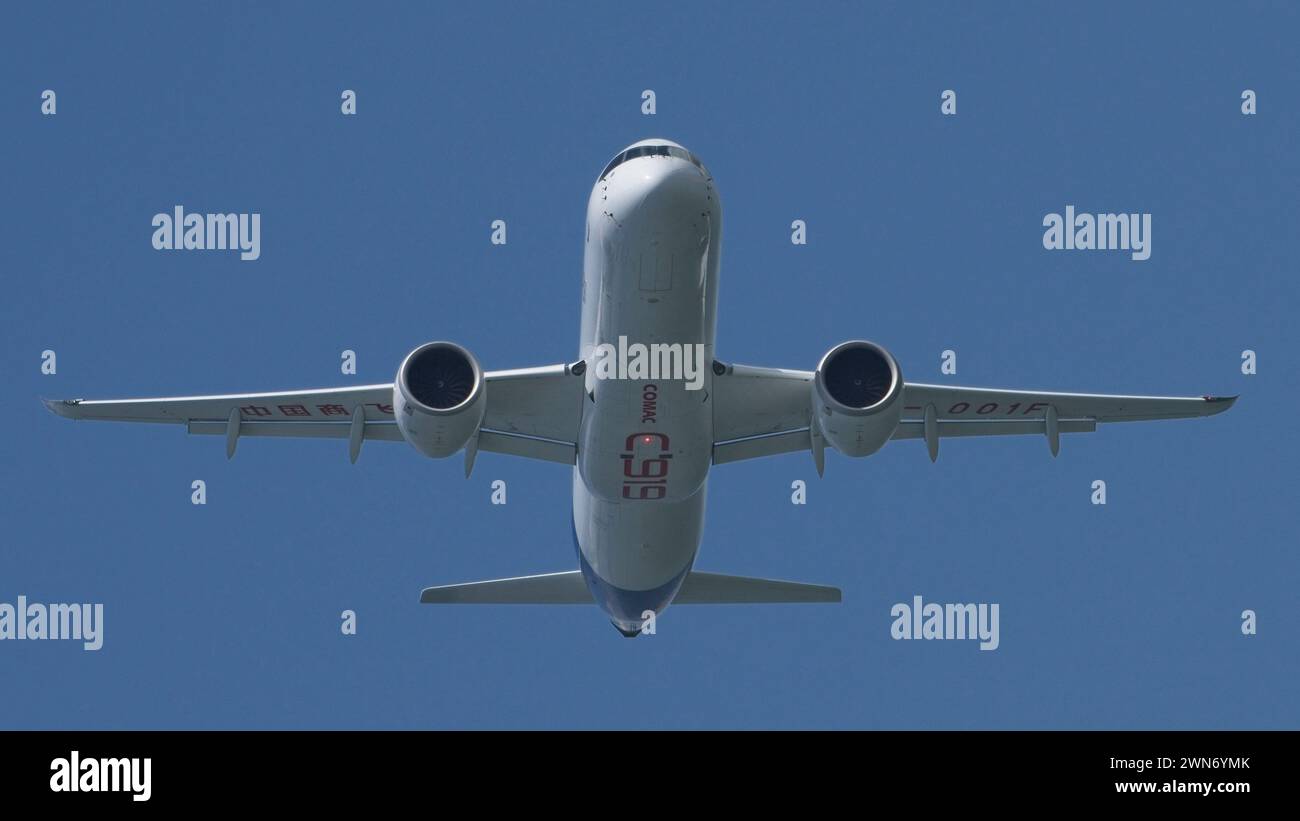 SINGAPORE - FEBRUARY 20, 2024:  China commercial narrow-body aircraft, the COMAC C919 B-001F doing an aerial display at the Singapore Airshow 2024. Stock Photo