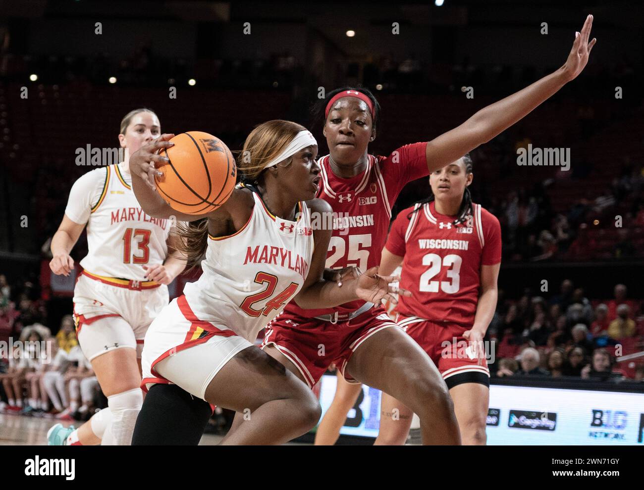 College Park, USA. 29th Feb, 2024. COLLEGE PARK, MD: - FEBRUARY 29: Maryland Terrapins guard Bri McDaniel (24) charges past Wisconsin Badgers forward Serah Williams (25) during a women's college basketball game between the Maryland Terrapins and the Wisconsin Badgers at Xfinity Center, in College Park, Maryland on February 29, 2024. (Photo by Tony Quinn/SipaUSA) Credit: Sipa USA/Alamy Live News Stock Photo