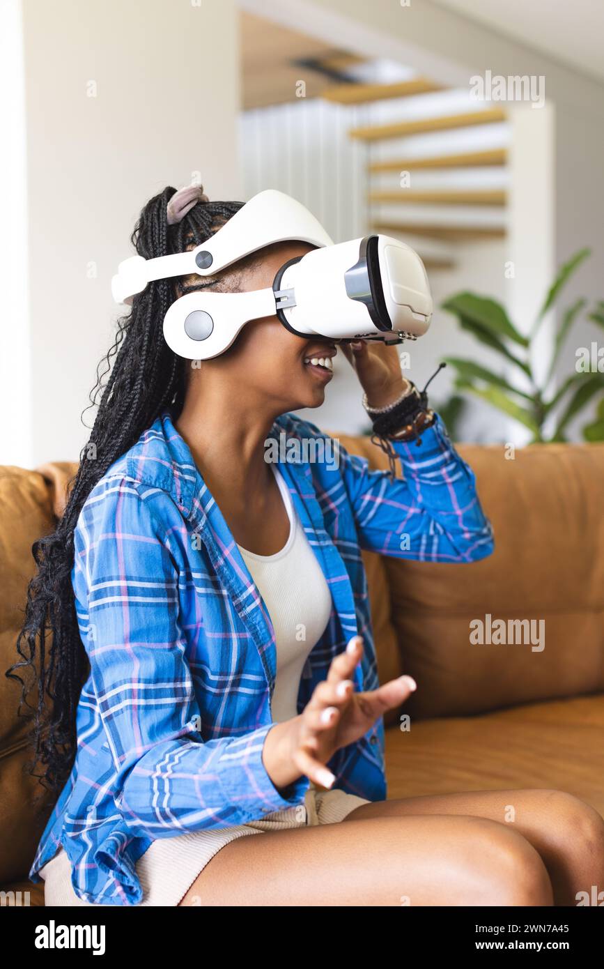 Young woman wears virtual reality hi-res stock photography and images ...