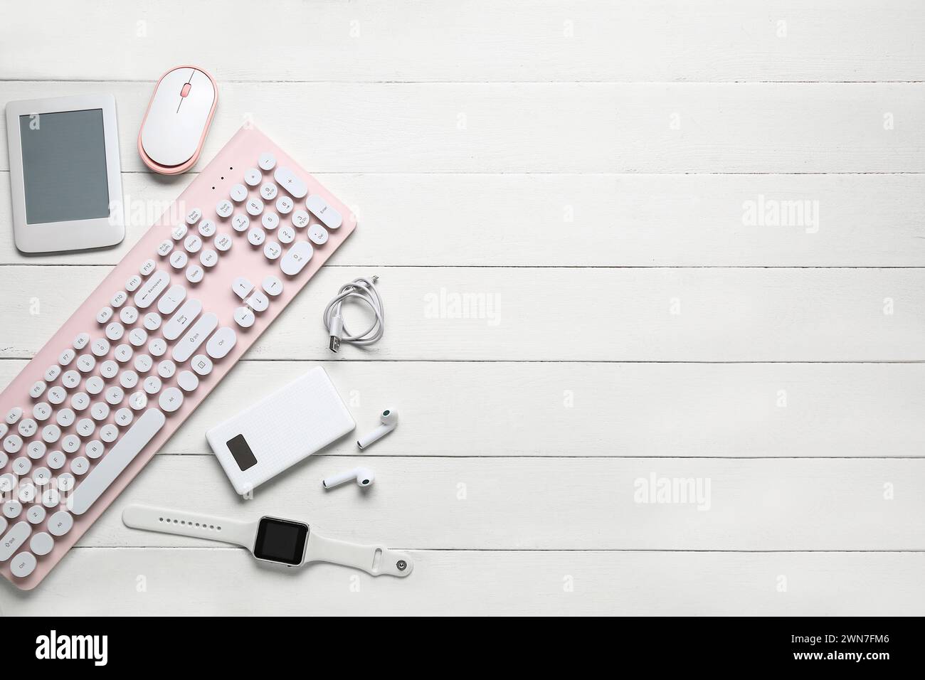 Composition with different modern gadgets on white wooden background Stock Photo