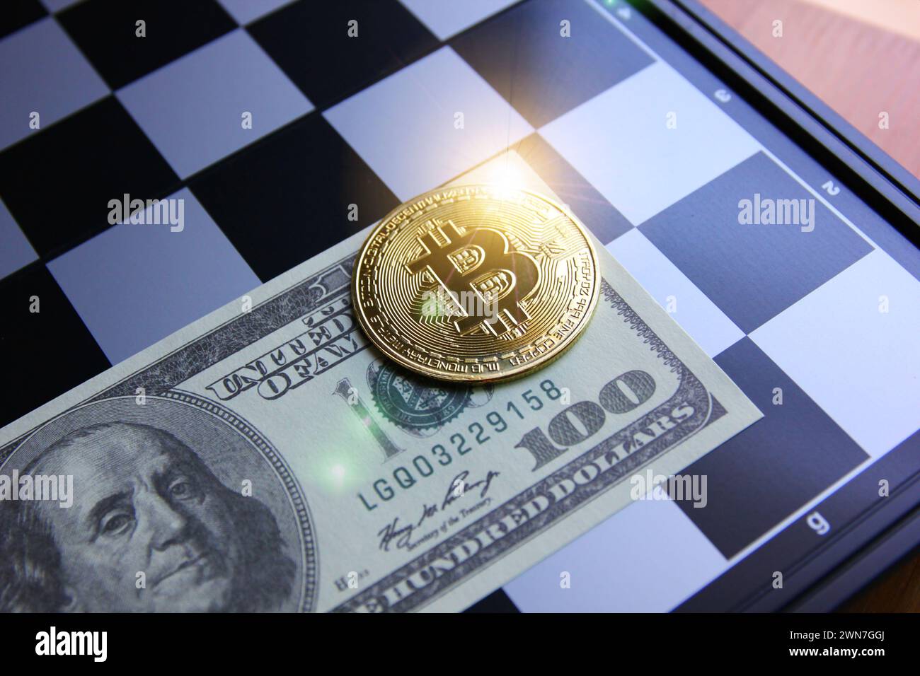 bit coin on American dollar bank note with chess board Stock Photo