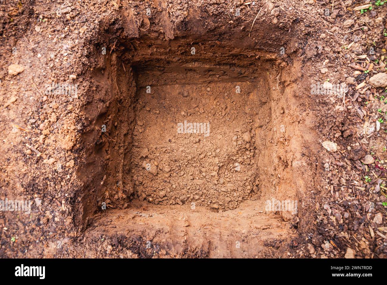 Hole in a soil, prepared for planting or construction, pit in a ground ...