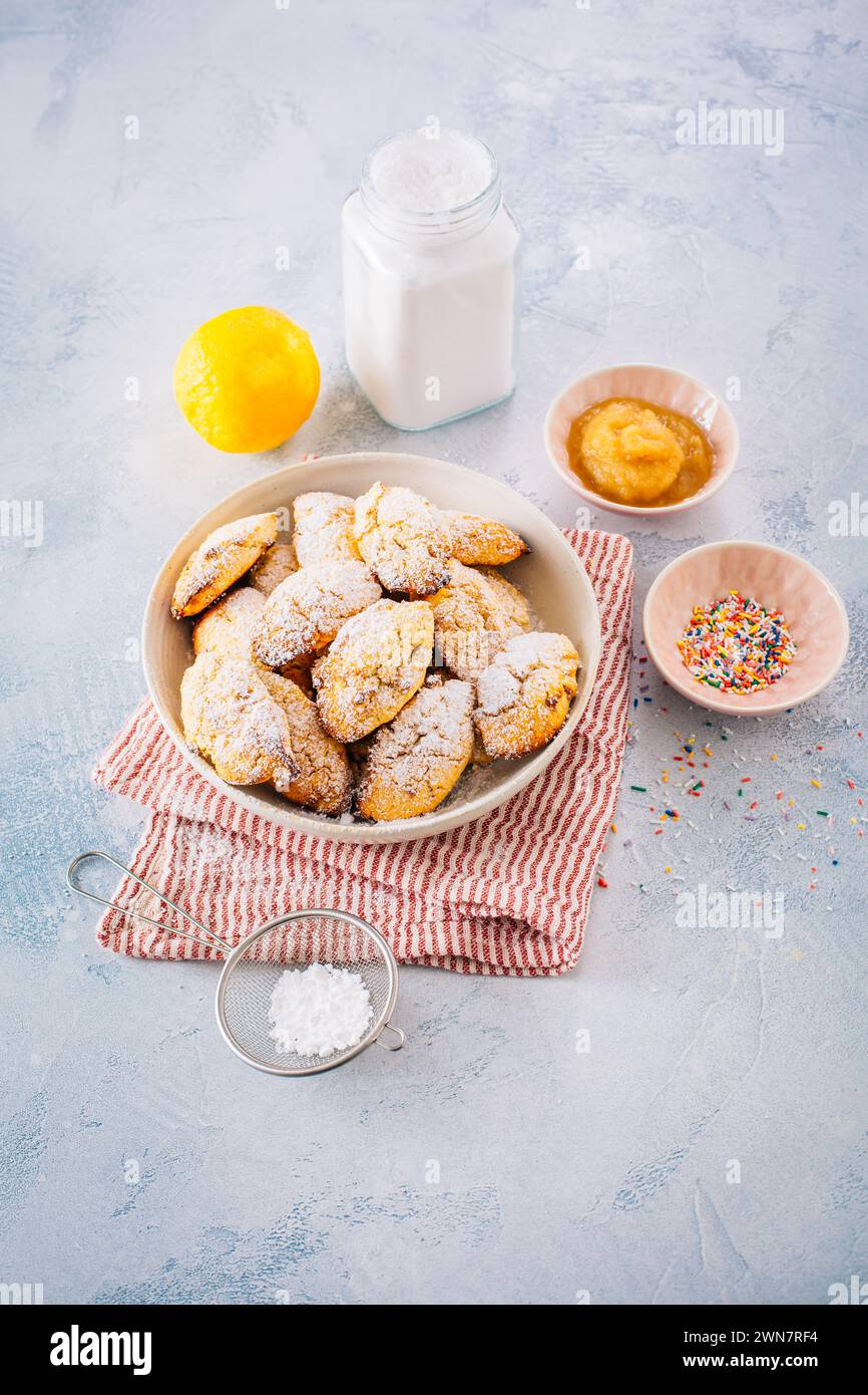 Homemade cottage cheese donuts balls with powdered sugar and apple sauce Stock Photo