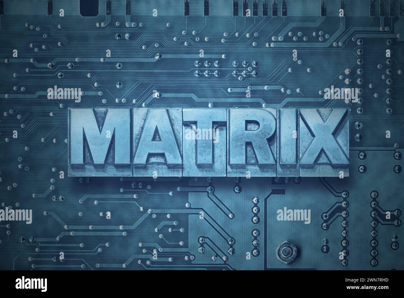matrix word made from metallic letterpress blocks on the pc board background Stock Photo