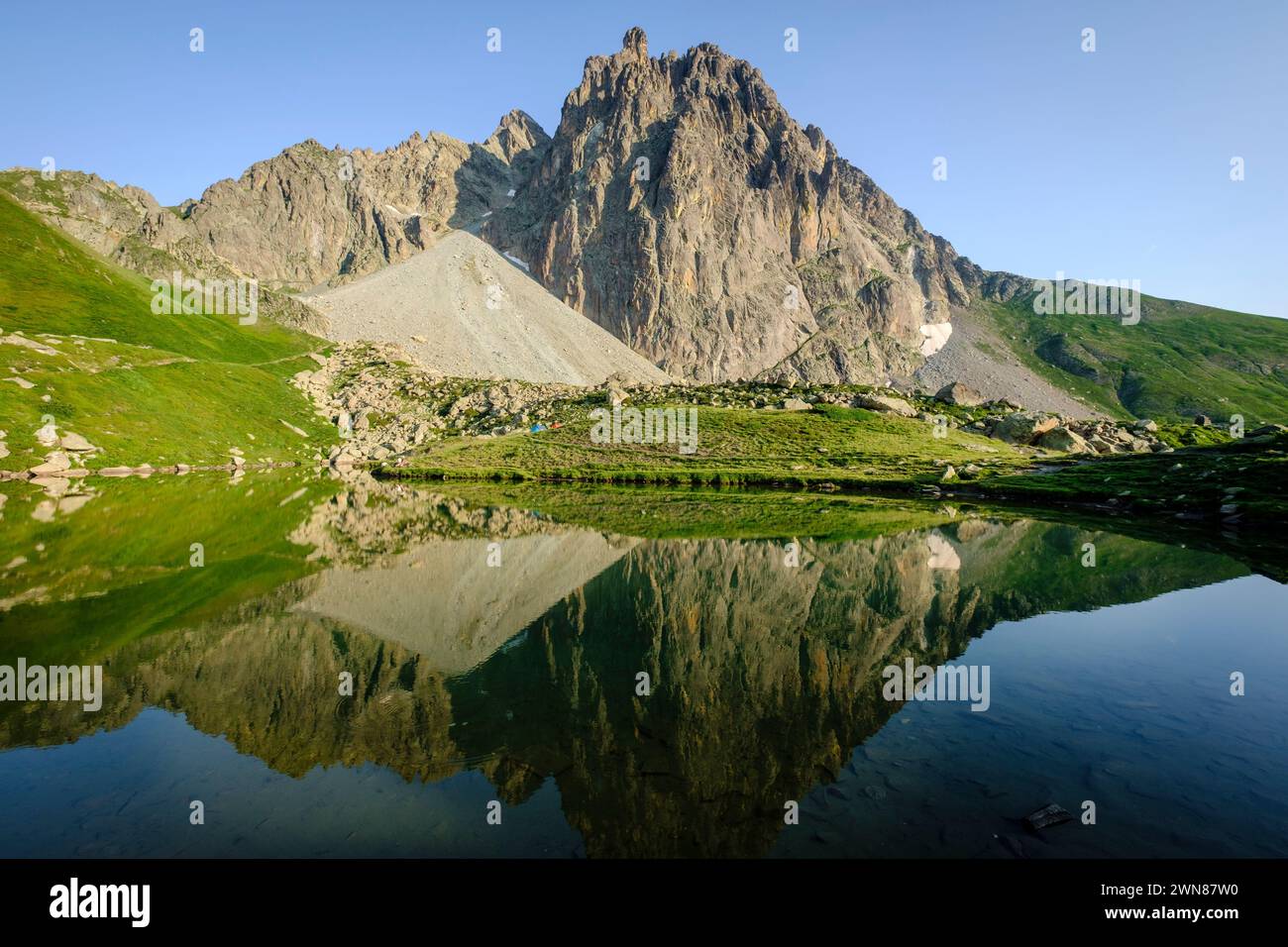 Midi d'Ossau peak, 2884 meters, and Pombie lake, Pyrenees National Park, Pyrenees Atlantiques, France Stock Photo