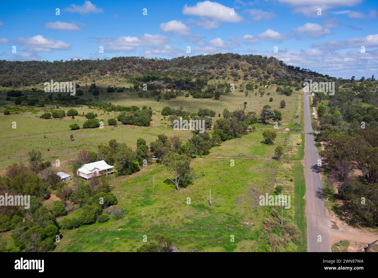 Aerial of rural road leading out of Cracow Queensland Australia Stock Photo
