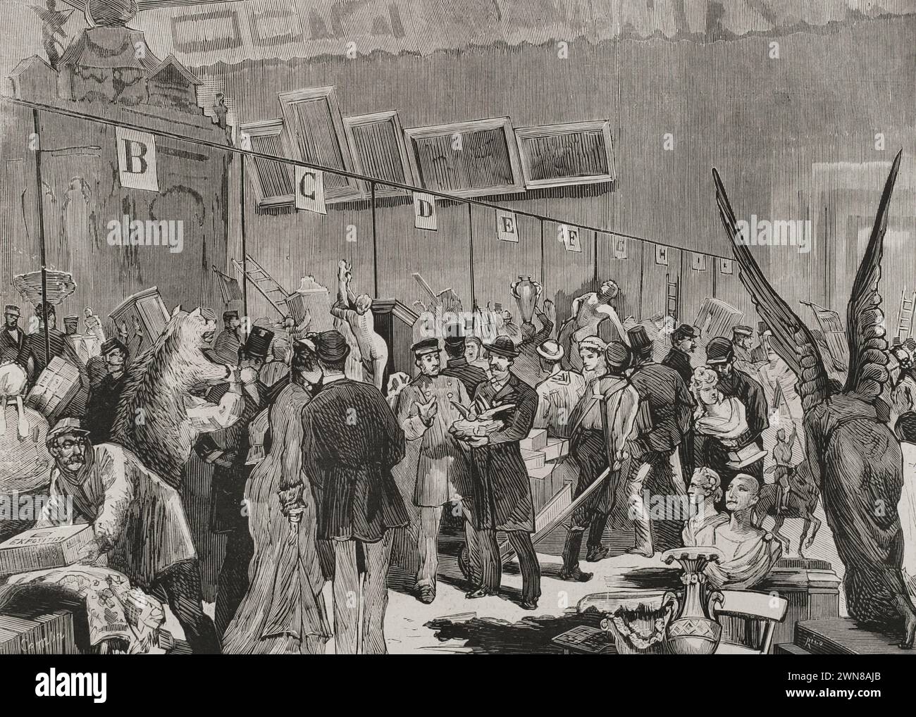 France, Paris. Reception of lots for the National Lottery, to be drawn on 10 January 1879 at the Grand Palais des Champs-Élysées (Great Palace of the Elysian Fields). Delivery and sorting of the lots in the Great Salon of the palace. The exposition of them opened on December 25, 1878. The central stall contained the most valuable lots, where temporary counters were placed, marked with the letters of the alphabet, in which the objects were deposited and inscribed. Drawing by Comba. Engraving by Rico. La Ilustración Española y Americana (The Spanish and American Illustration), 1878. Stock Photo