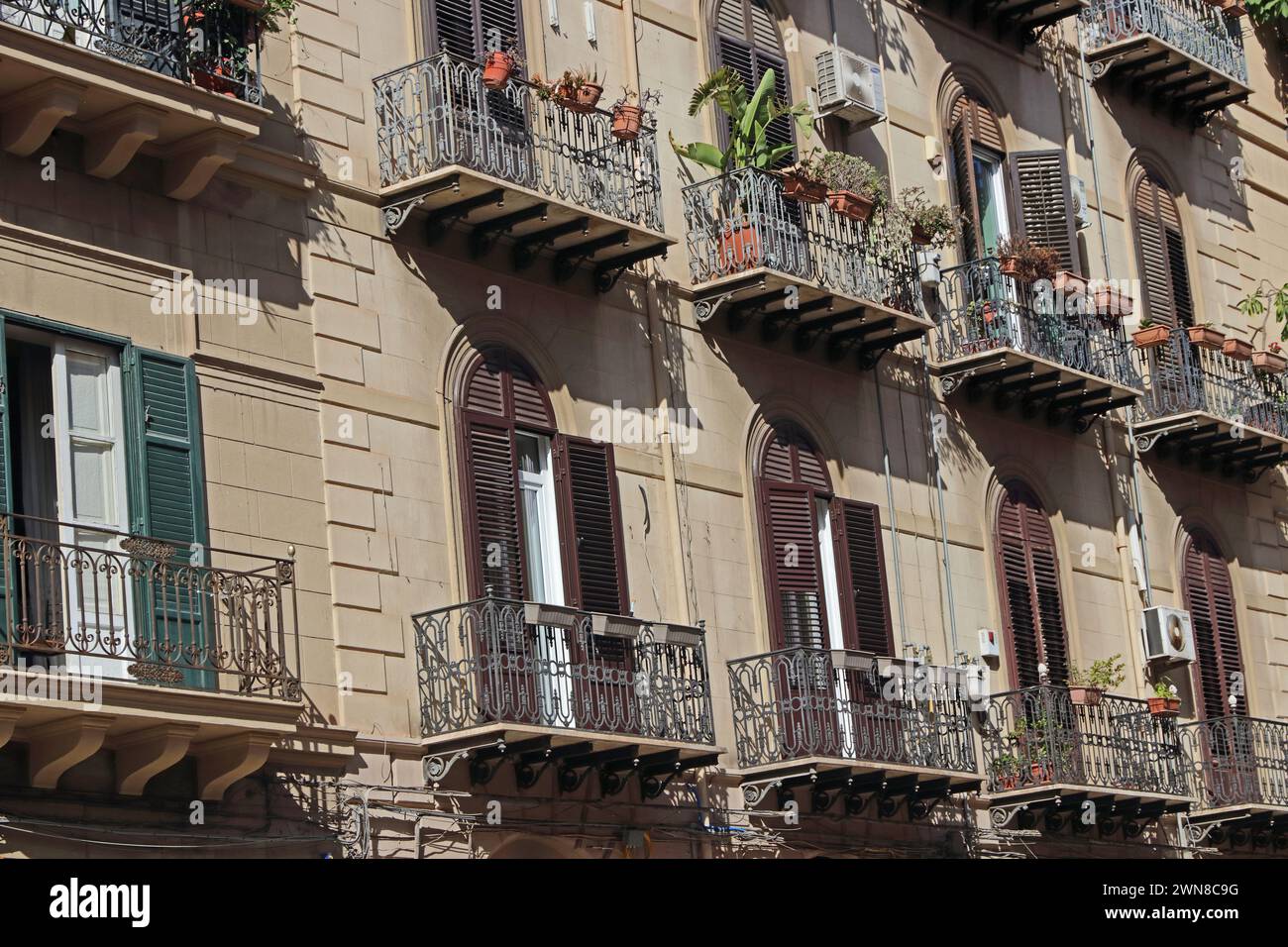 Traditional block of house with balconies and metal railings, Palermo, Sicily Stock Photo