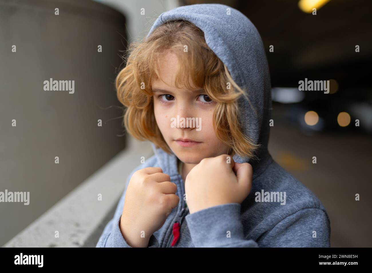 Aggressive child. Aggression kid boy fighting on street. Angry ...
