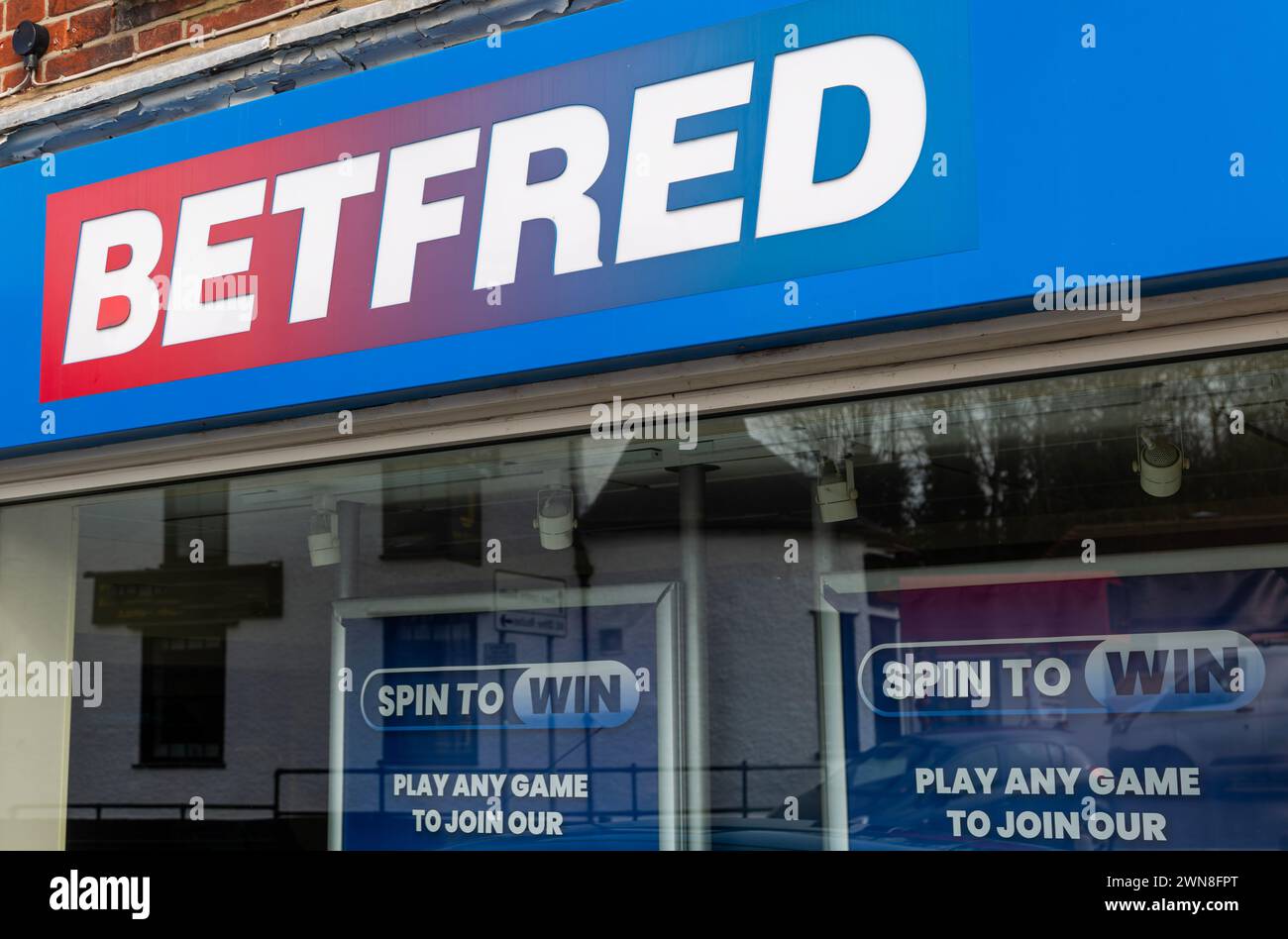 Signs outside Betfred bookmakers shop, Stowmarket, Suffolk, England, UK Stock Photo