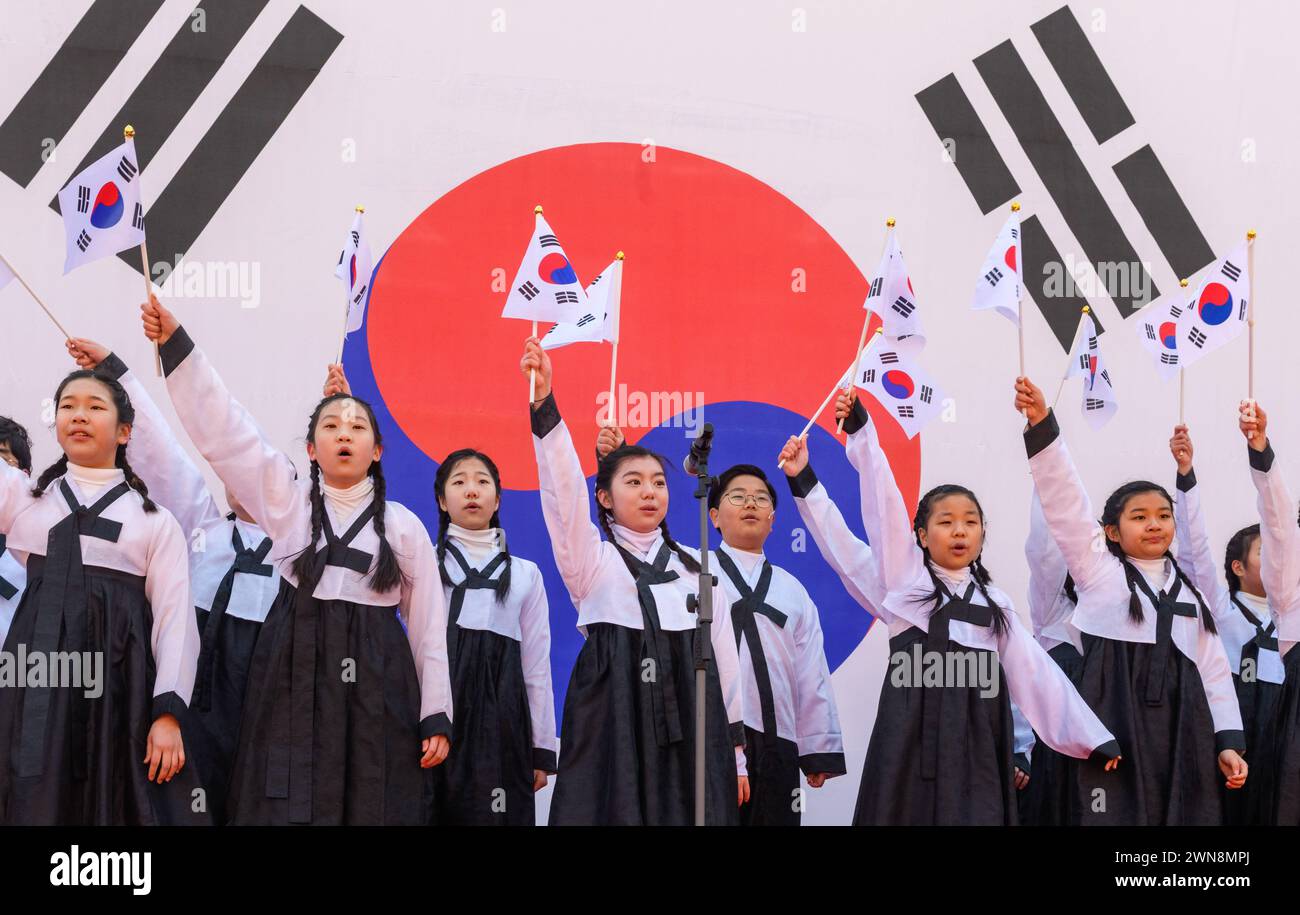 Seoul, South Korea. 01st Mar, 2024. South Korean children wave national flags during a ceremony for Korean Independence Movement Day in Seoul. The Korean Independence Movement Day, also known as the March 1st Movement, was an important protest movement of Koreans in early 1919 demanding independence from Japan and an end to forced assimilation into Japanese culture. (Photo by Kim Jae-Hwan/SOPA Images/Sipa USA) Credit: Sipa USA/Alamy Live News Stock Photo