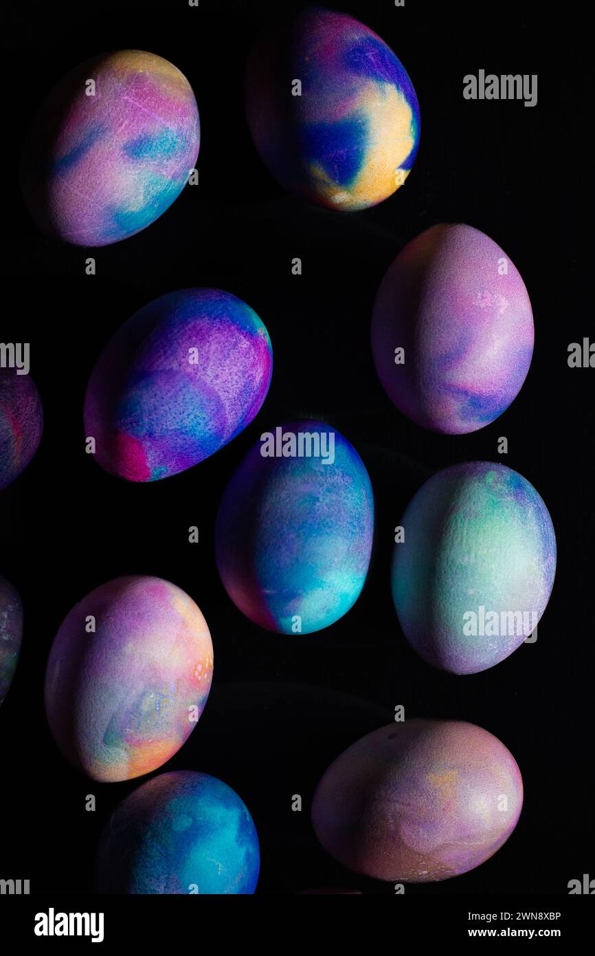 Colorful Dyed Easter Eggs against black backdrop Stock Photo