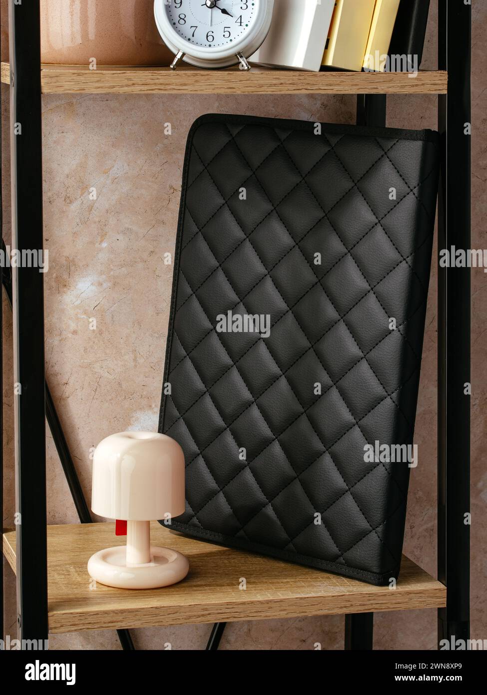a leather folder for documents is on the shelf Stock Photo