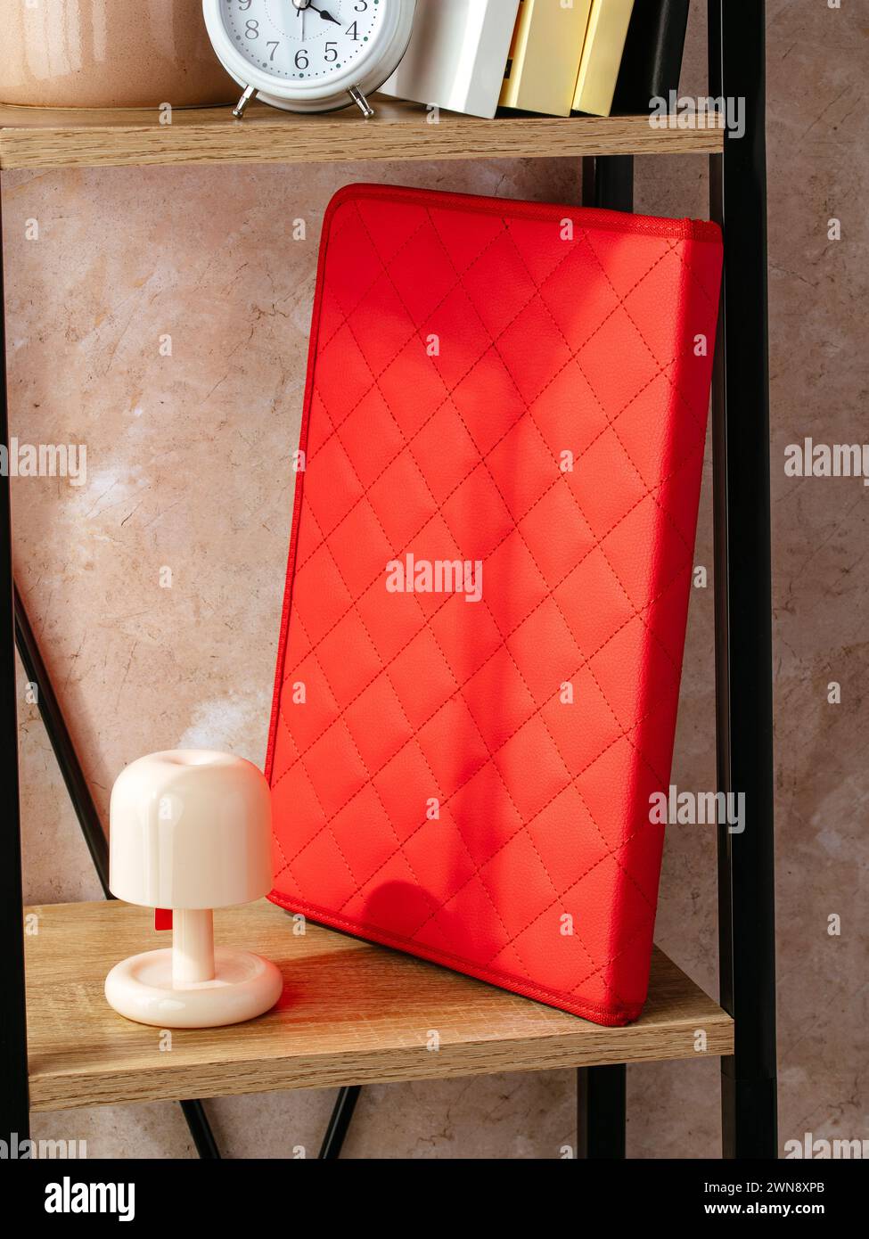 a leather folder for documents is on the shelf Stock Photo
