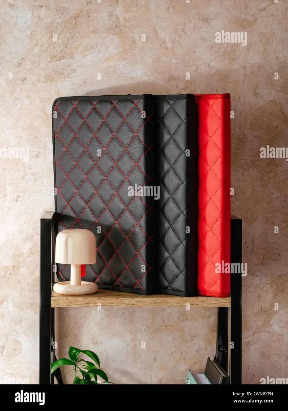 a leather folder for documents is on the shelf Stock Photo