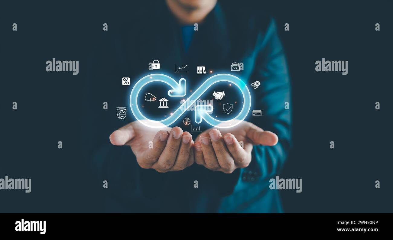 Businessman Hands holding virtual infinity with technology marketing online icon, a symbol of connection to community metaverse world network system a Stock Photo