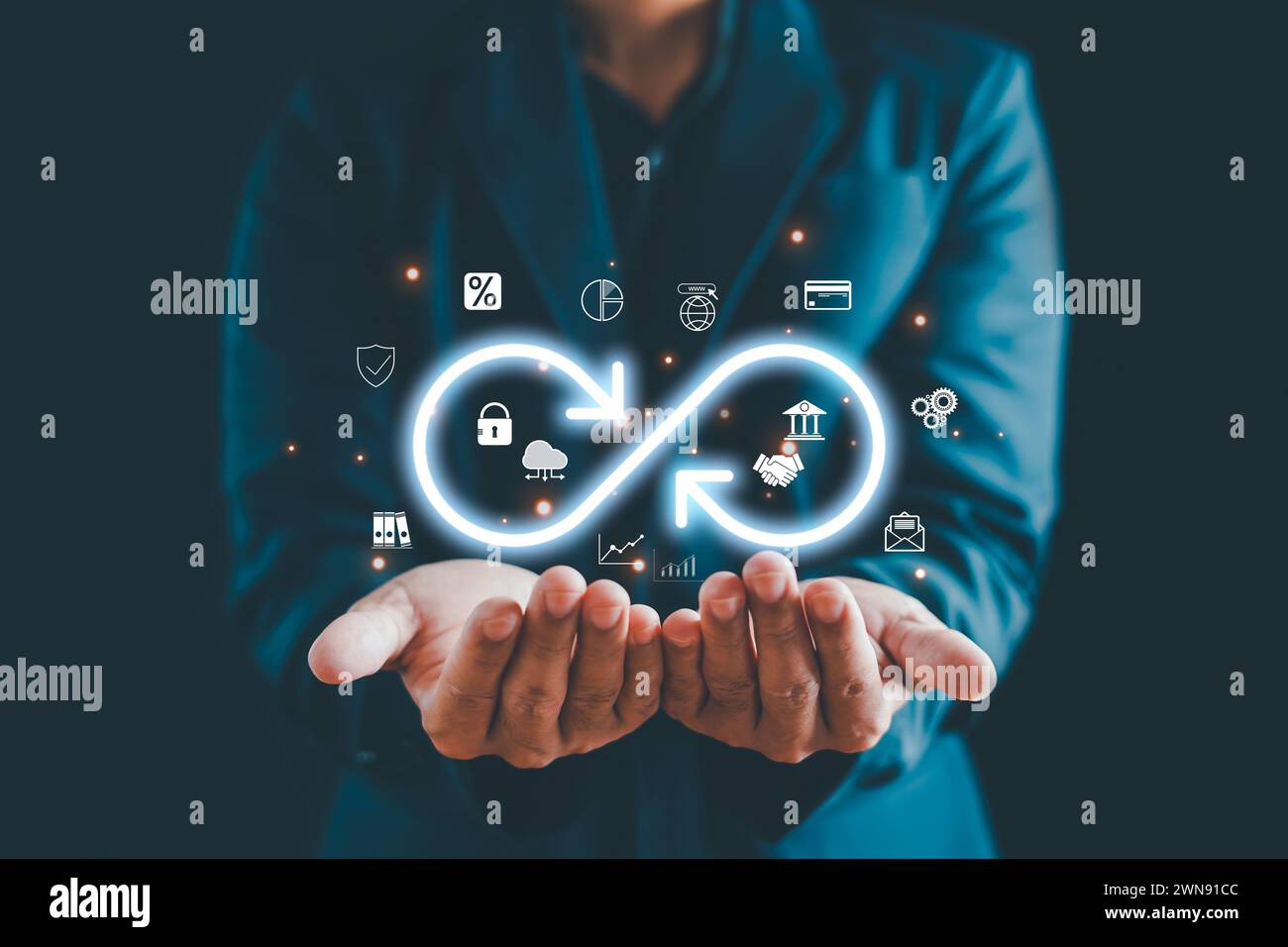 Businessman Hands holding virtual infinity with technology marketing online icon, a symbol of connection to community metaverse world network system a Stock Photo